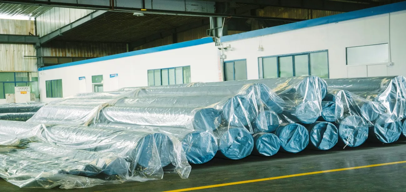Seamless steel pipes stacked in warehouse ready for dispatch