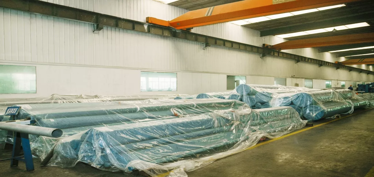 Finished seamless steel pipes waiting for shipment in warehouse